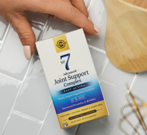 A hand showing the packaging of Solgar® No. 7 Vegetable Capsules
