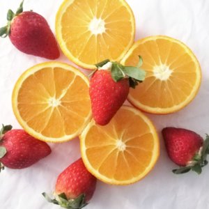 Sliced oranges and strawberries