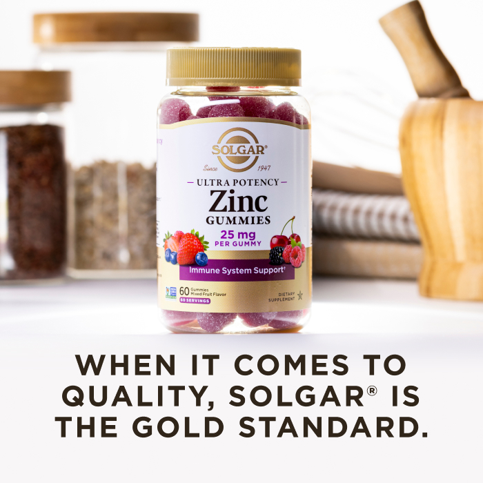 A bottle of Solgar Ultra Potency Zinc gummies in a kitchen scene on a white countertop. The image says, "When it comes to quality, Solgar is the Gold Standard."