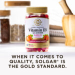 A bottle of Solgar Ultra Potency Vitamin D3 gummies in a kitchen scene on a white countertop. The image says, "When it comes to quality, Solgar is the Gold Standard."