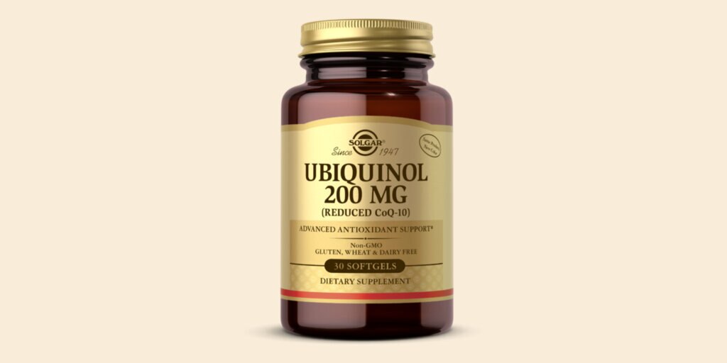 A bottle of Solgar Ubiquinol 200mg softgels on a cream background. 
