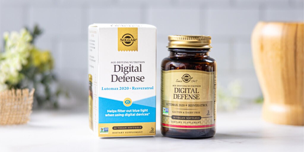 A box and bottle of Solgar Digital Defense Eye Health Softgels sitting in a clean, white kitchen setting. 