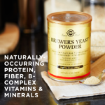 A container of Solgar's Brewer's Yeast Powder on a cloth with some powder next to it on a spoon. Text reads "naturally occurring protein, fiber, b-complex vitamins and minerals."