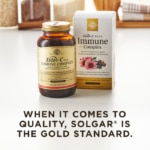 An amber bottle of Solgar's Ester-C® Plus Immune Complex softgels next to its white-and-gold outer packaging on a white surface. Text overlaid reads: "When it comes to quality, Solgar® is the Gold Standard."