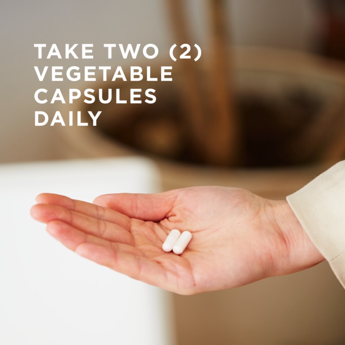 Two of Solgar's Chromium Picolinate 500 mcg Vegetable Capsules held in an open hand. Text reads "take two vegetable capsules daily"