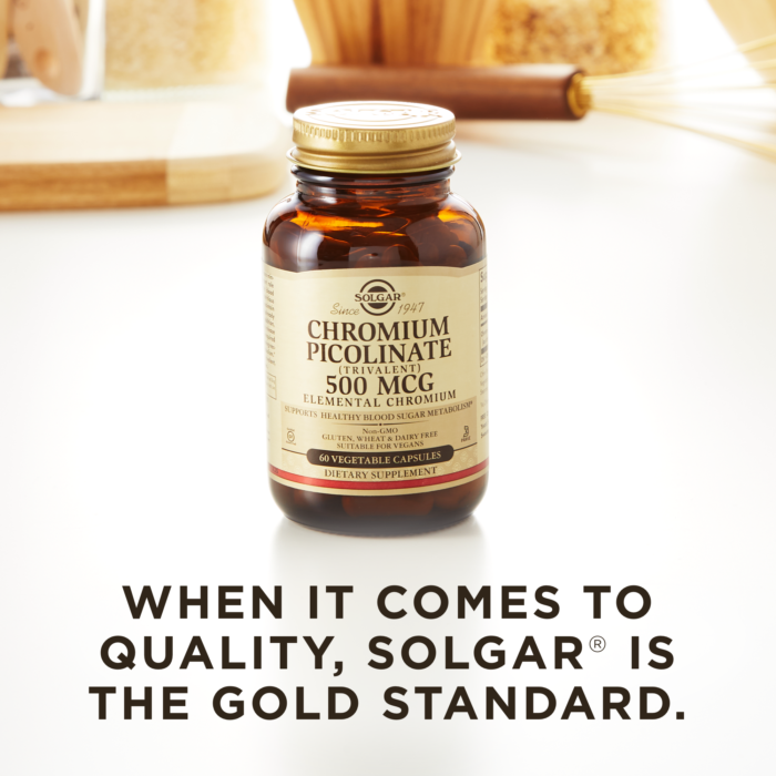 A bottle of Solgar's Chromium Picolinate 500 mcg Vegetable Capsules on a kitchen surface. Text reads "When it comes to quality, Solgar is the gold standard."