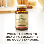 A bottle of Solgar's Ester-C® Plus 500 mg Vitamin C Vegetable Capsules (Ester-C® Ascorbate Complex) on a kitchen countertop. Text reads "When it comes to quality, Solgar is the gold standard."