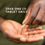 One of Solgar's Ester-C® Plus 1000 mg Vitamin C Tablets (Ester-C® Ascorbate Complex) being picked up from one hand by another. Text reads "take one tablet daily"