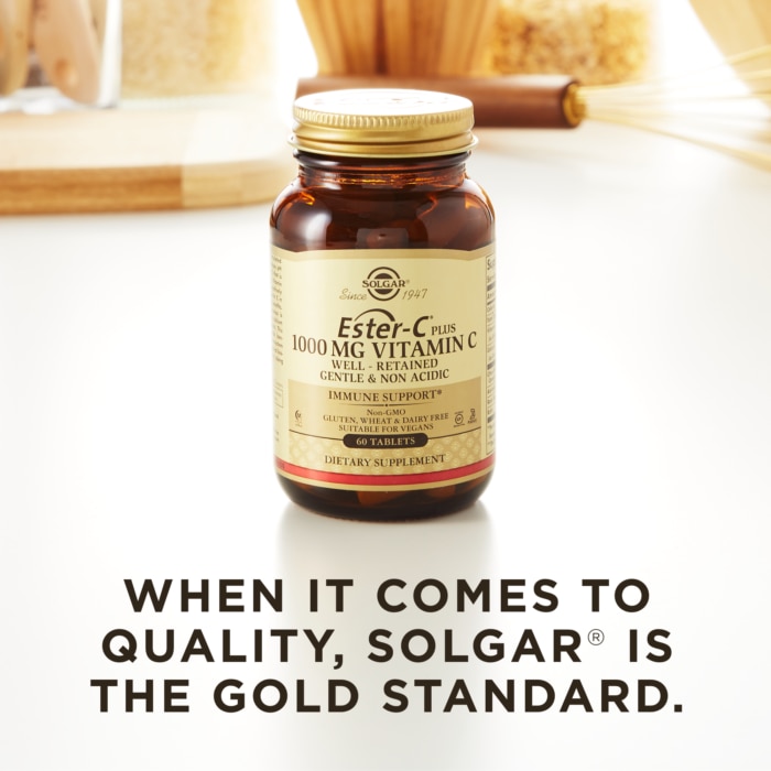 A bottle of Solgar's Ester-C® Plus 1000 mg Vitamin C Vegetable Capsules (Ester-C® Ascorbate Complex) on a surface. Text reads "When it comes to quality, Solgar is the gold standard."