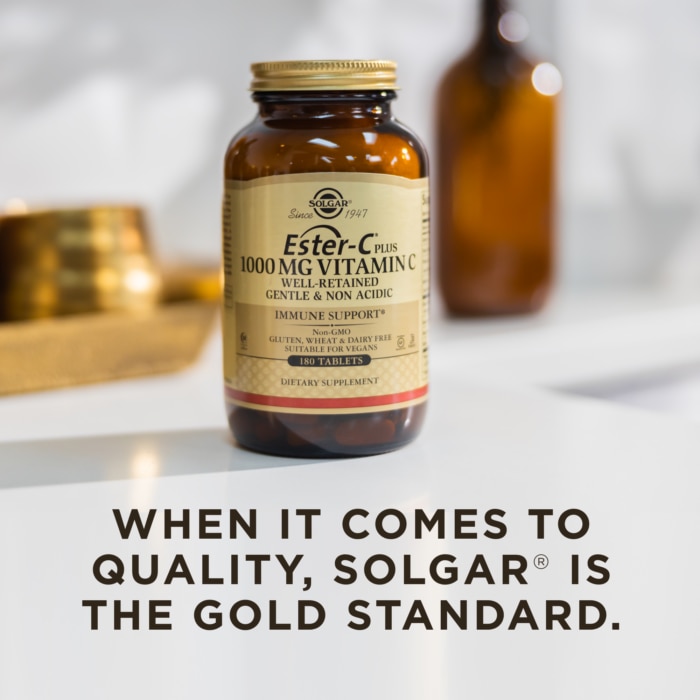 A bottle of Solgar's Ester-C® Plus 1000 mg Vitamin C Vegetable Capsules (Ester-C® Ascorbate Complex) on a surface. Text reads "When it comes to quality, Solgar is the gold standard."