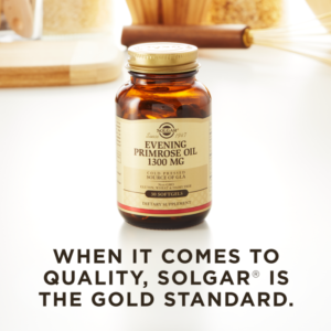 A bottle of Solgar's Evening Primrose Oil 1300 mg Softgels on a kitchen surface. Text reads "When it comes to quality, Solgar is the gold standard."