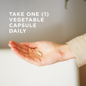 An outstretched hand holds a small vegetable capsule of Solgar's Gentle Iron. A text overlay reads: "Take one vegetable capsule daily."