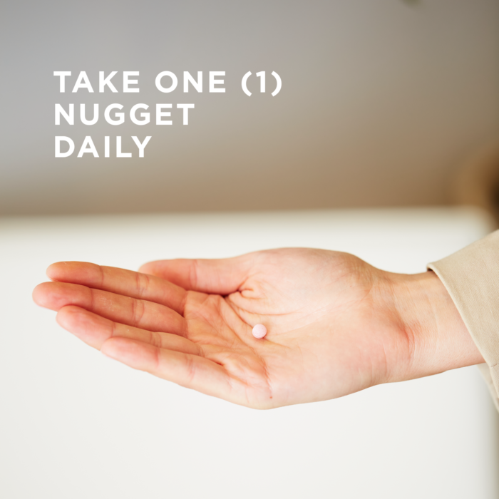 One nugget of Solgar's Methylcobalamin (Vitamin B12) held on the palm of a hand. Text reads "take one nugget daily"
