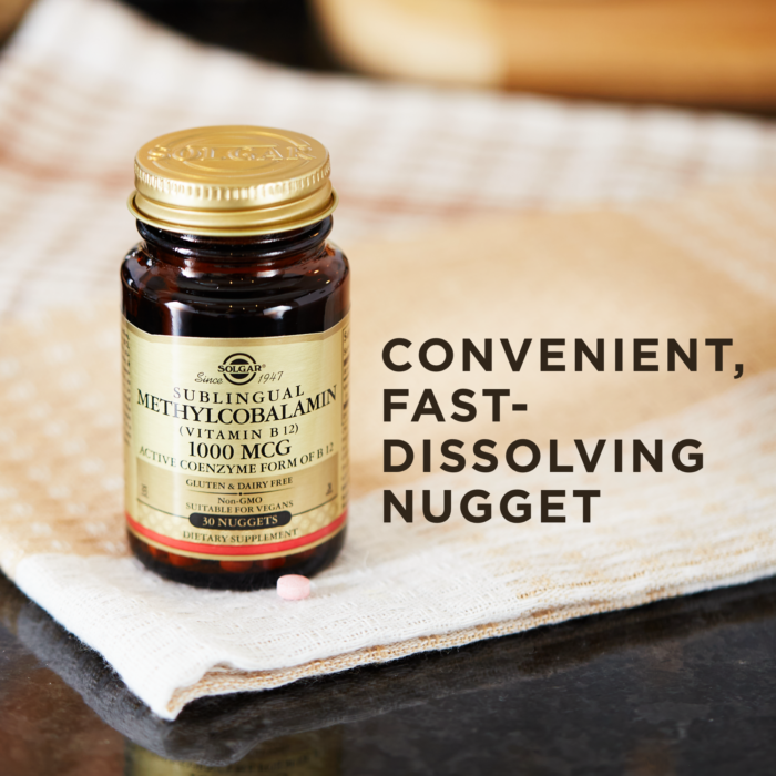 A bottle of Solgar's Methylcobalamin Vitamin B12 on a cloth surface. Text reads "convenient, fast-dissolving nugget"
