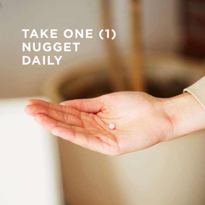 One nugget of Solgar's Methylcobalamin (Vitamin B12) held on the palm of a hand. Text reads "take one nugget daily"
