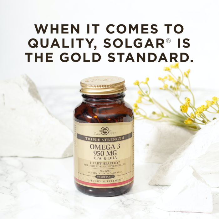 A bottle of Solgar's Triple Strength Omega-3 softgels on a marble surface. Text reads "When it comes to quality, Solgar is the gold standard."