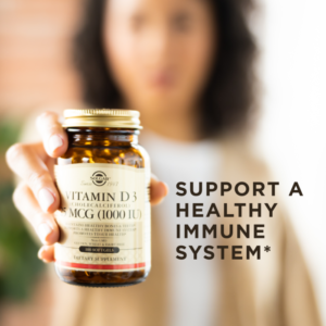 Solgar's Vitamin D3 Cholecalciferol softgels held up in one hand. Text reads "Support a healthy immune system*"