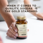 A bottle of Solgar's Vitamin D3 Cholecalciferol softgels on a kitchen surface. Text reads "When it comes to quality, Solgar is the gold standard."