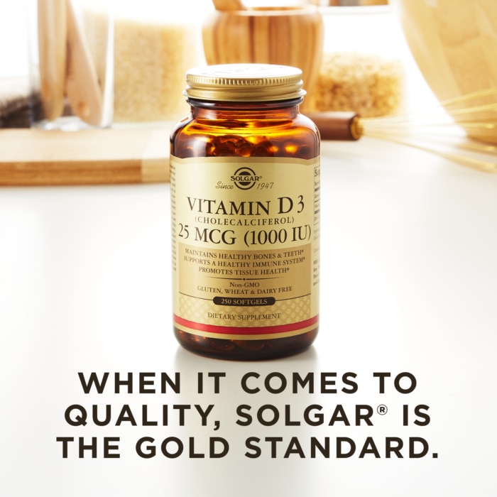 A bottle of Solgar's Vitamin D3 Cholecalciferol softgels on a kitchen surface. Text reads 