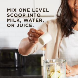 A woman holds a level scoop of Solgar's Whey To Go® Protein Powder in Vanilla flavor over a blender cup. Text overlaid reads "Mix one level scoop into milk, water, or juice."
