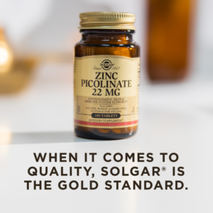 A bottle of Solgar's zinc picolinate on a blurry light backdrop. Text reads "When it comes to quality, Solgar is the gold standard."