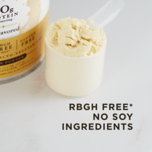 A scoop of Solgar's plain Whey To Go® protein powder sits on a counter next to the container it came from. Text overlaid reads "rGBH free*, no soy ingredients."