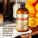 A bottle of Solgar's Liquid Calcium Magnesium Citrate with Vitamin D3 - Natural Orange Vanilla Flavor next to a some oranges in a bowl. Text reads "delicious natural orange vanilla flavor"